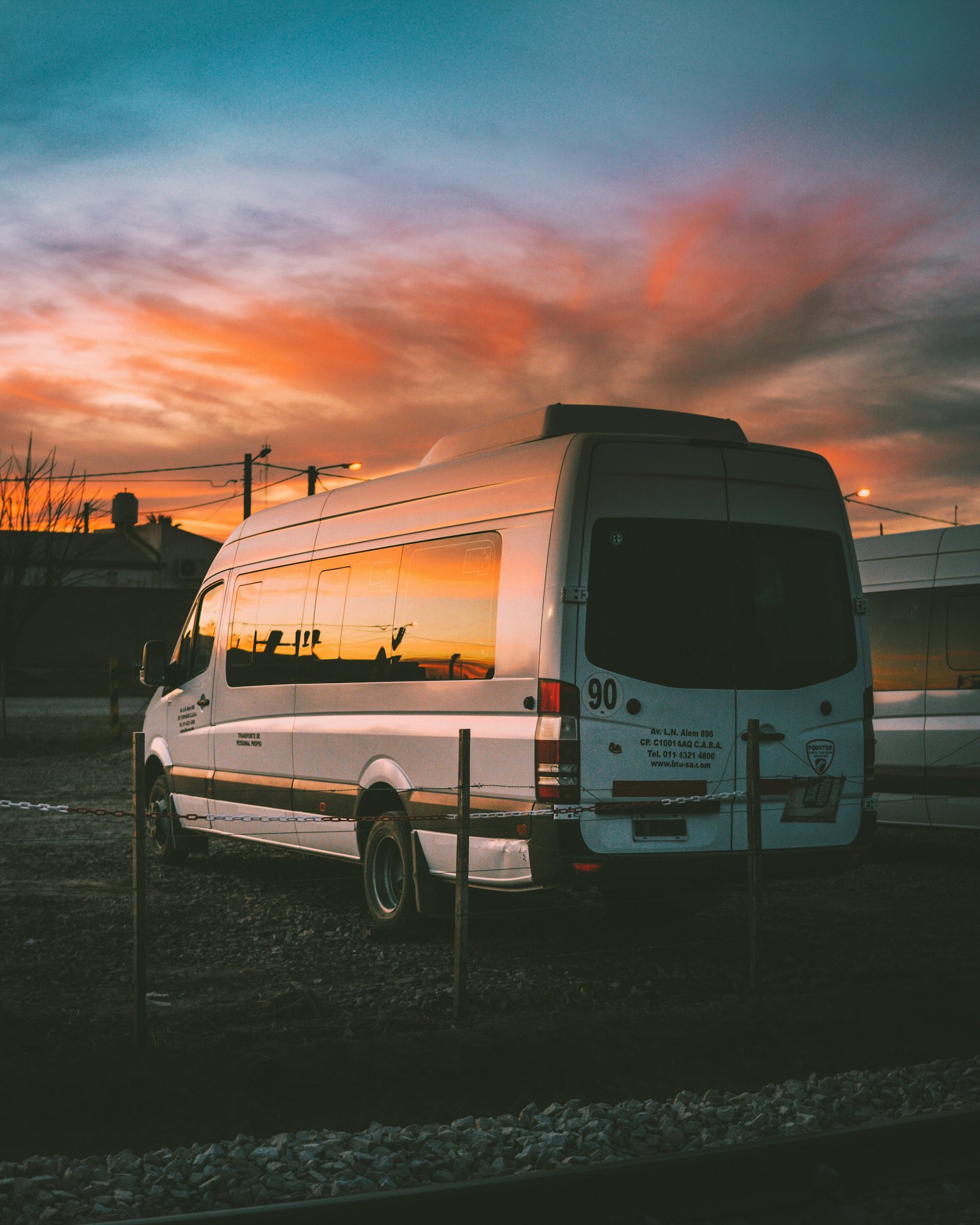 Minibus parked at dusk ready for a group airport transfer
