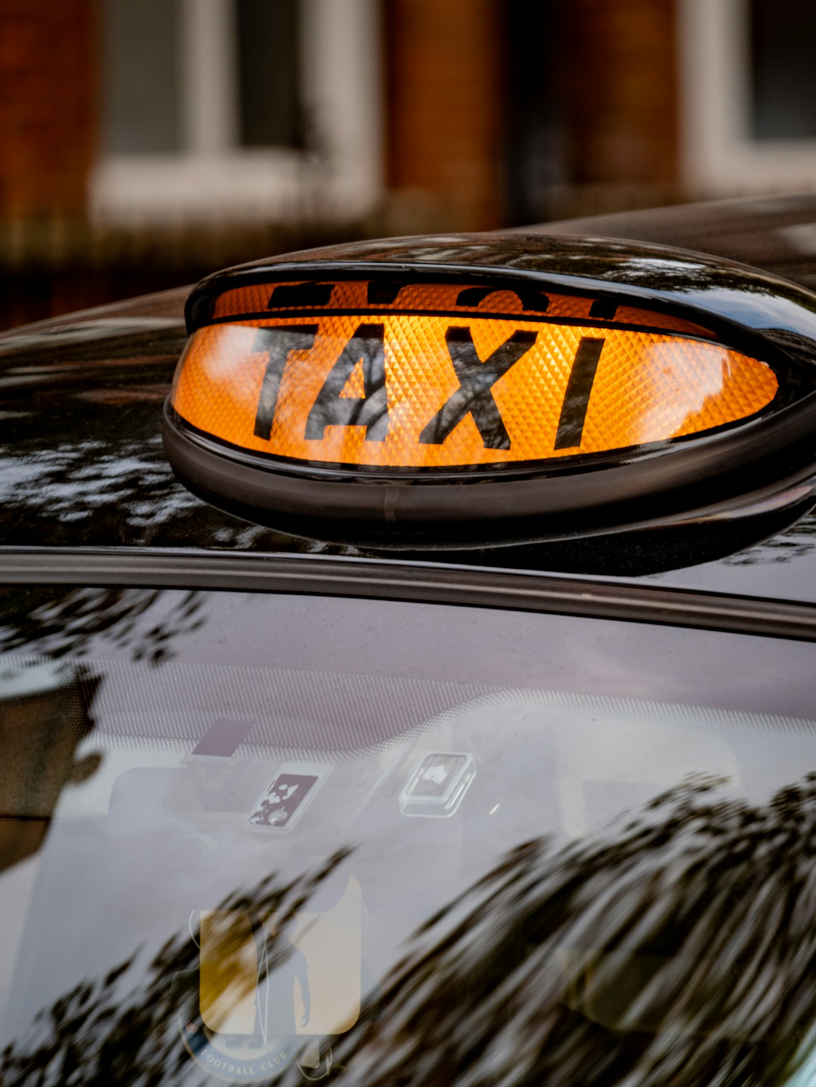 Close-up of an illuminated taxi roof sign